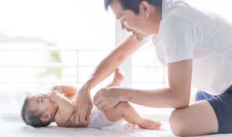 Father changing diaper.