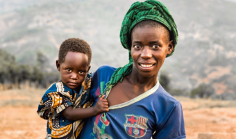 Rwandan mother carrying her child